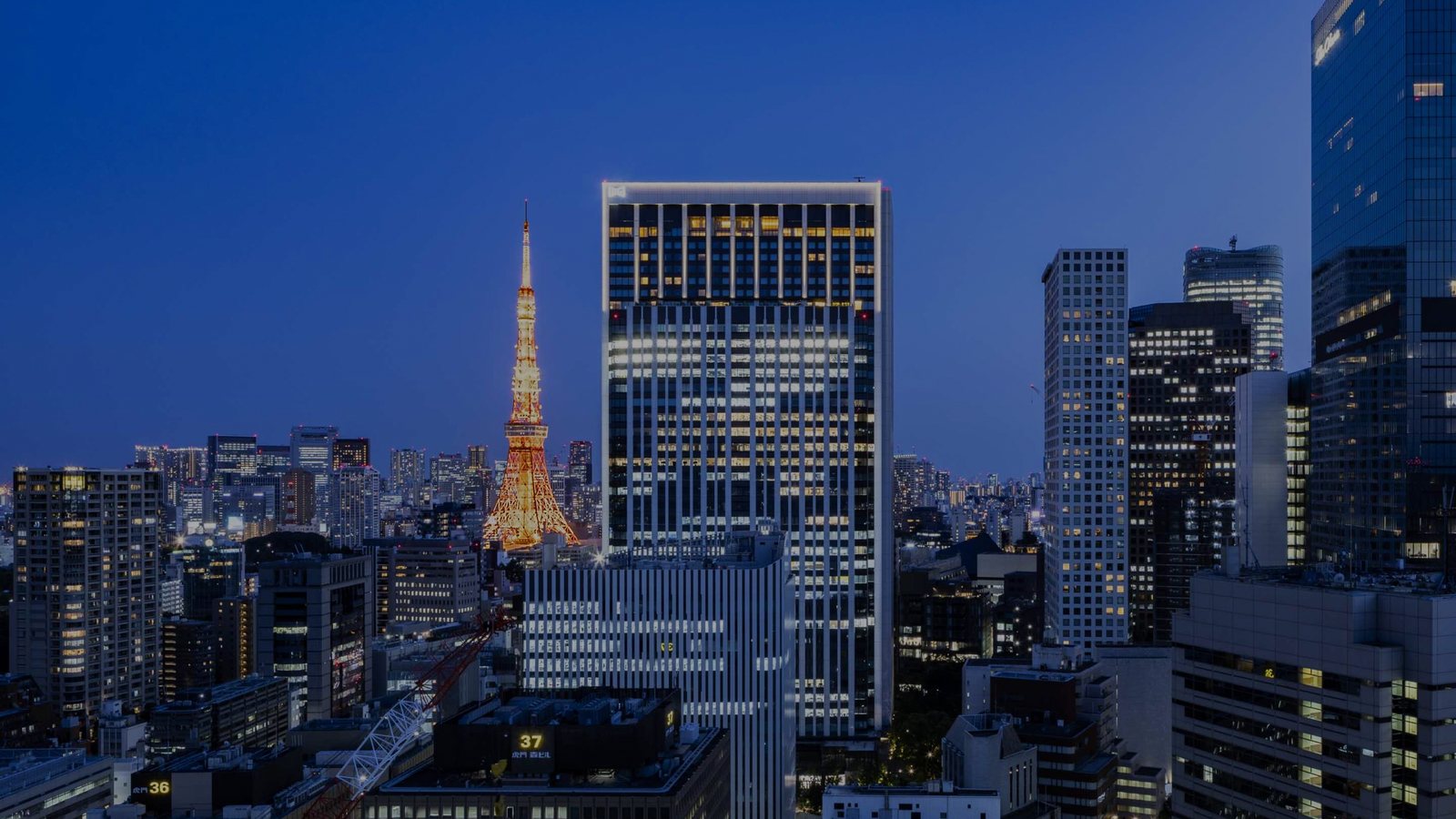 Kamiyacho Trust Tower and Tokyo Tower at dusk